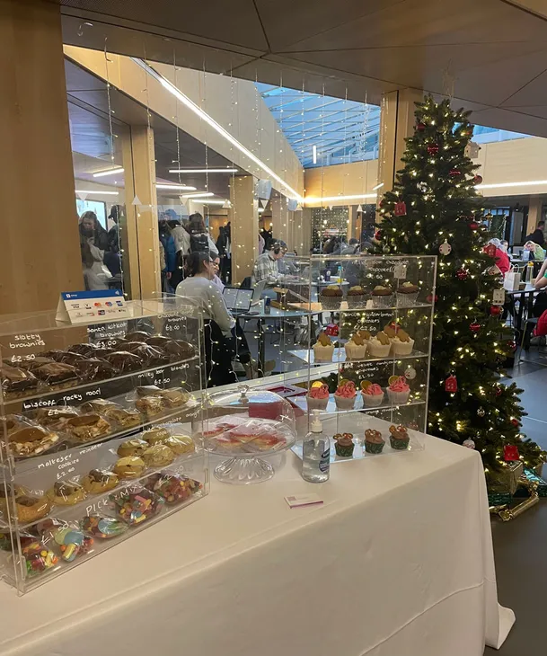 A festive market stall with lots of cupcakes