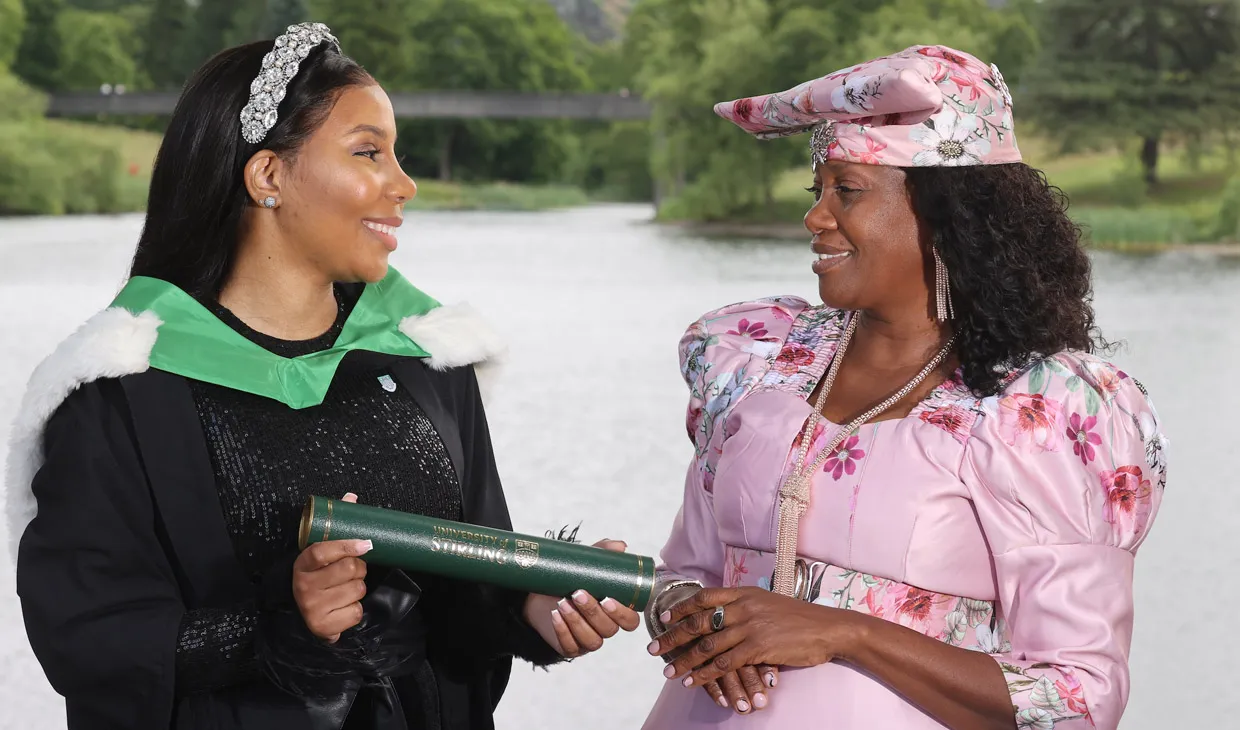 two people celebrating on graduation day