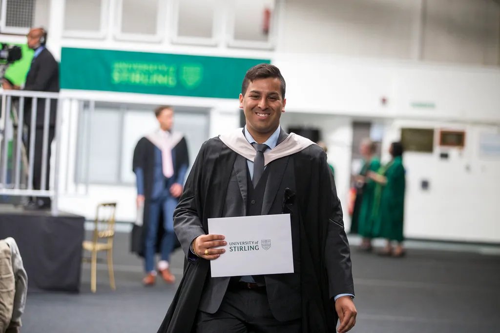 Graduate holding degree certificate