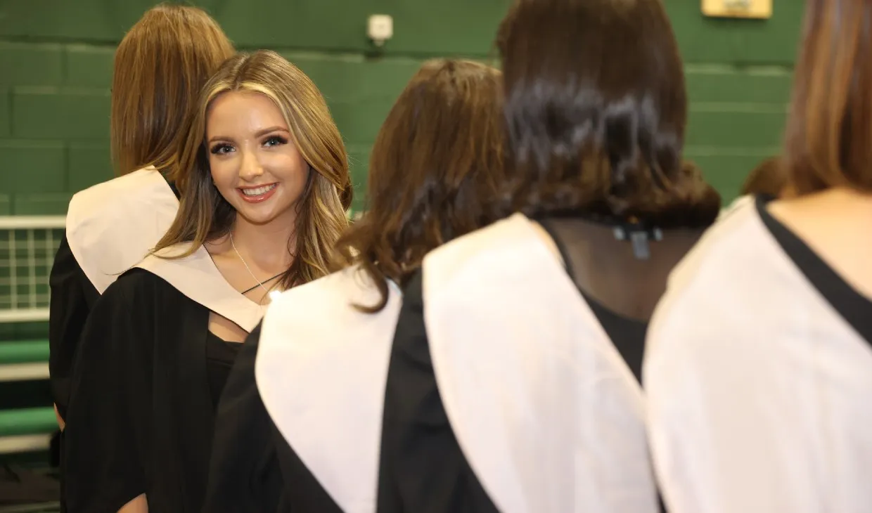Female graduand in graduation gown