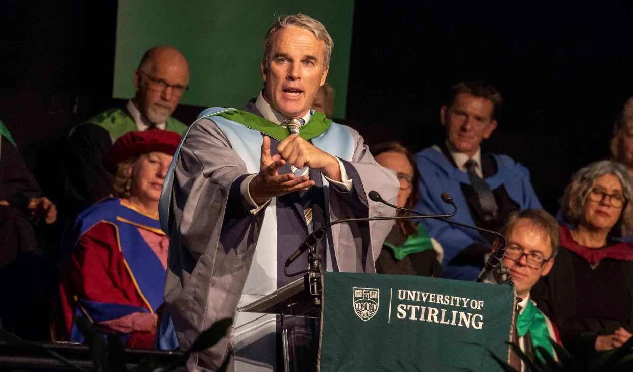 Lewis Pugh on stage giving his speech after receiving his honorary degree