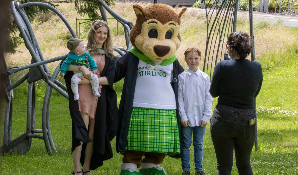 Graduates with squirrel mascot