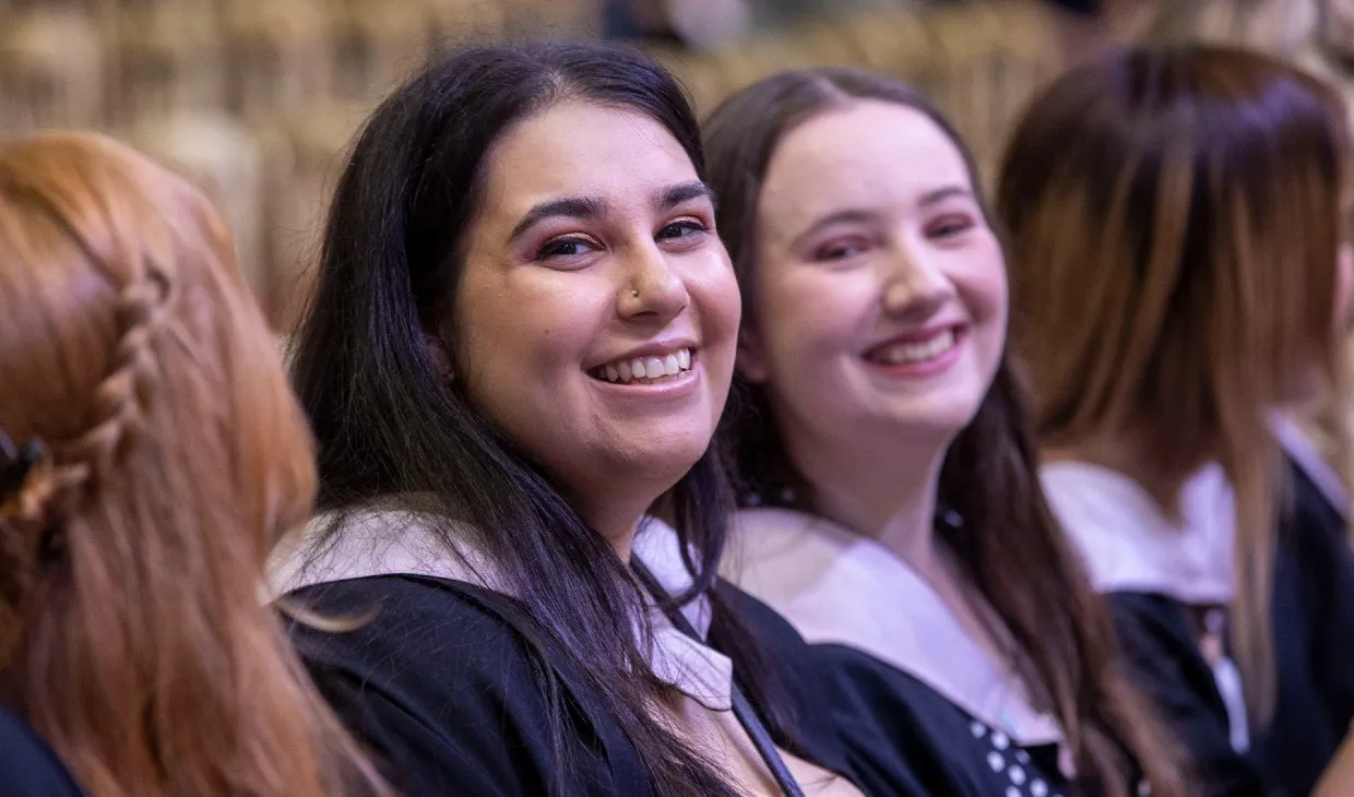 Graduands seated in graduation hall