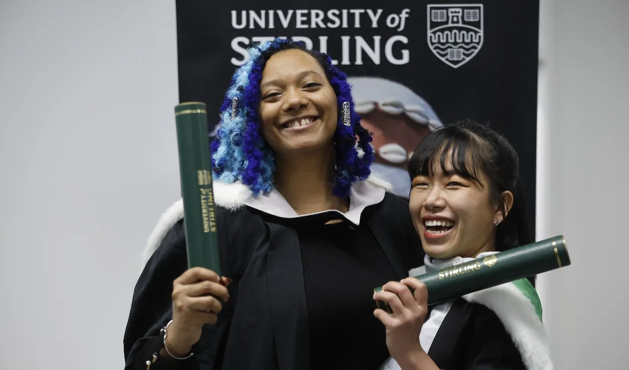 University of Stirling winter graduates celebrating - p3b