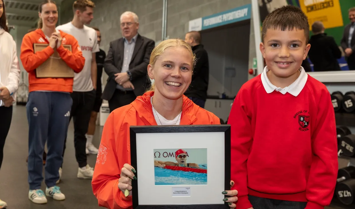 Olympians receive a warm welcome on their return to campus.
