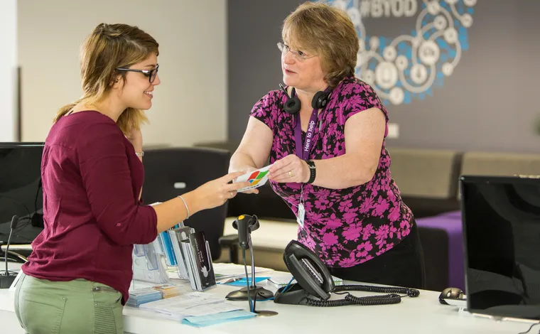 A person getting advice in the information centre