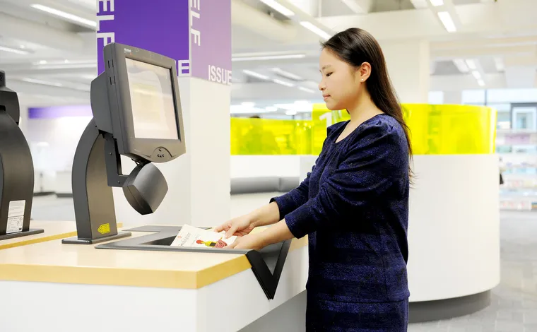 Image of a student borrowing books