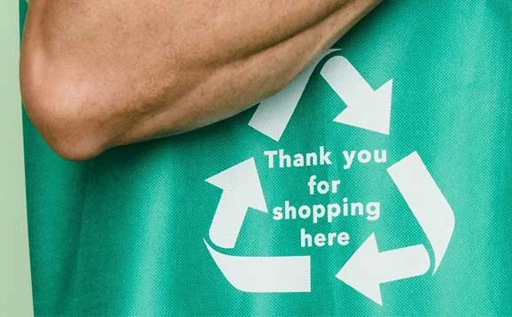 Green shopping bag on someone's arm