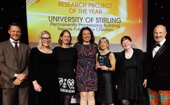 Group of people accepting an award