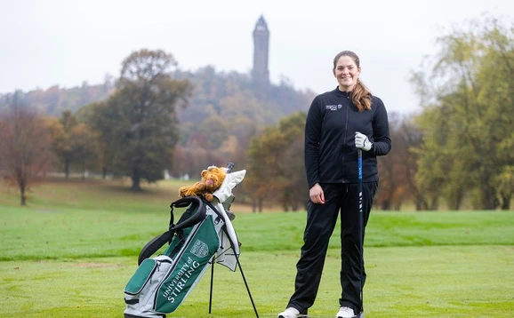 Golfer in front of Wallace Monument