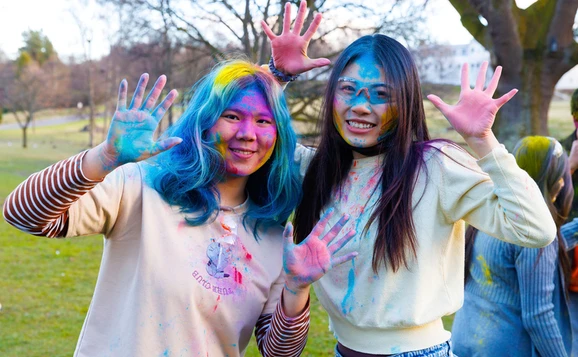 Two students celebrating Holi