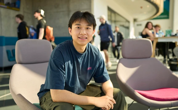 Student sitting in the Sports Centre cafe
