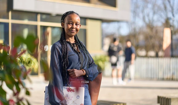 Student standing outside of Campus Central