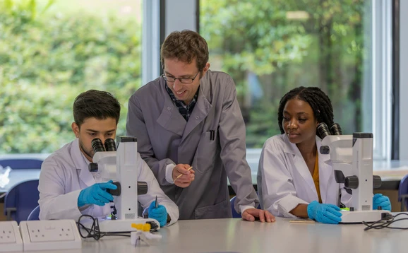 Students and tutor in a science lab