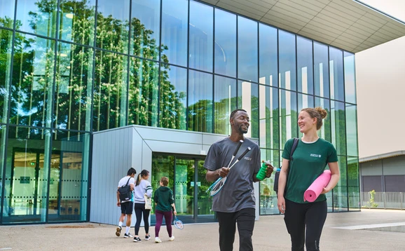 Students walking outside the Sports Centre
