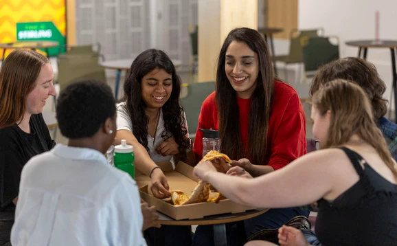 Students eating pizza