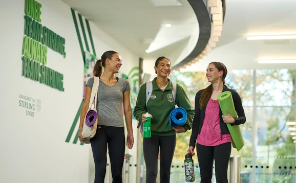 Students holding yoga mats at the Sports Centre