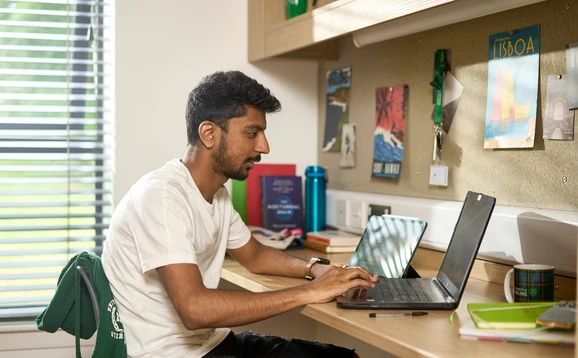 Student looking at a laptop