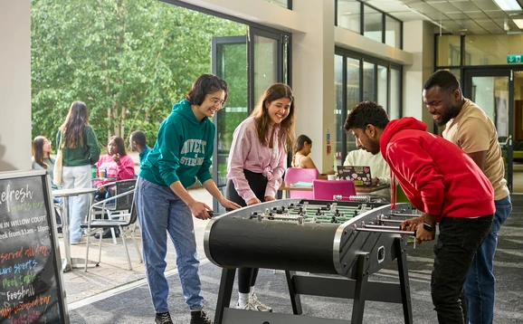 Students playing table football