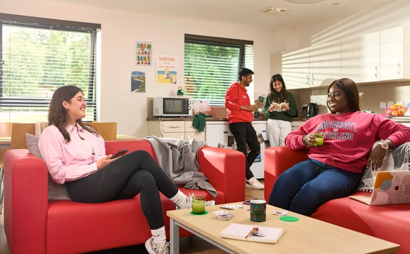 Students in the living area and kitchen