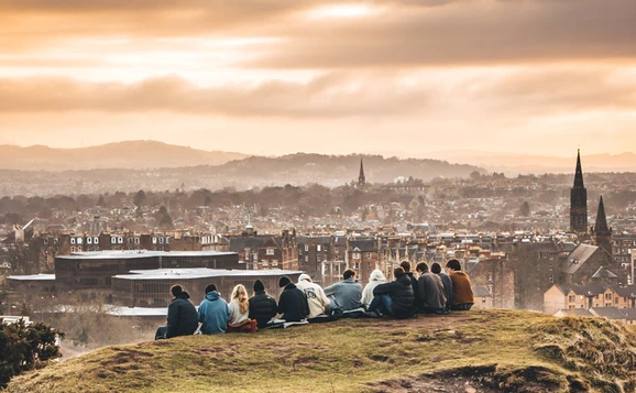 Students in Edinburgh looking at city skyline