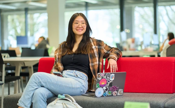 Student sitting on a sofa