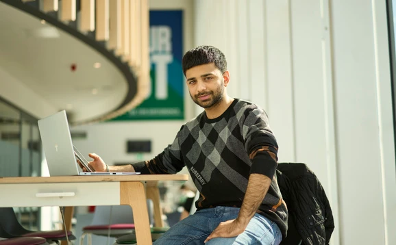 Student studying in the sports centre