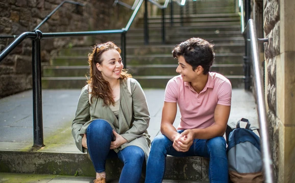 People sitting outside on a step