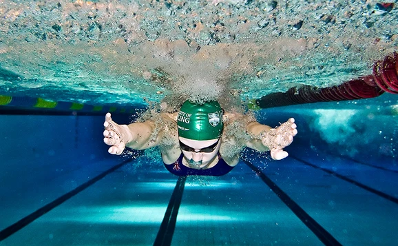 Image of a student swimming underwater