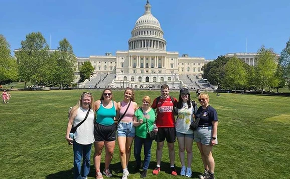 Group of nurses pose in front of Capital Building, Washington, USA