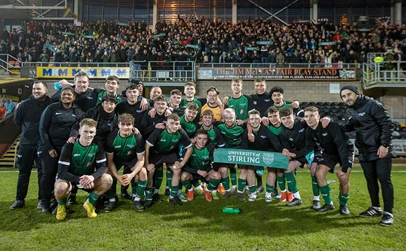 Group photo of mens football team after playing in Scottish Cup