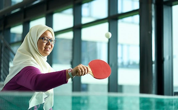 Student playing table tennis