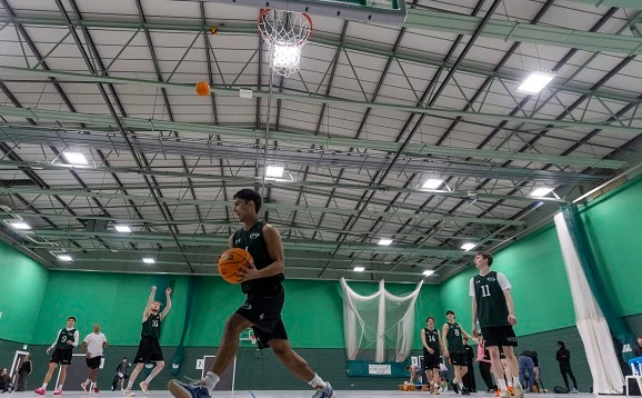 People playing basketball in the sports hall