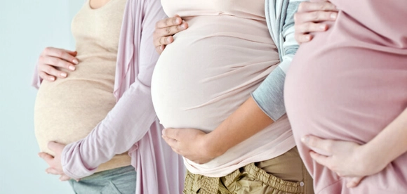 three pregnant bellies