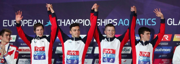 Duncan Scott celebrates with GB teammates on podium