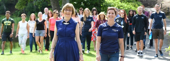 The Universitys Professor Maggie Cusack, Dean of the Faculty of Natural Sciences, and Cathy Gallagher, Executive Director of Sport, lead participants on a final celebratory walk around Campus