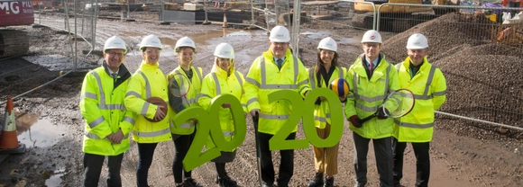 ҪԹ and Morrison Construction representatives on construction site of new sports centre