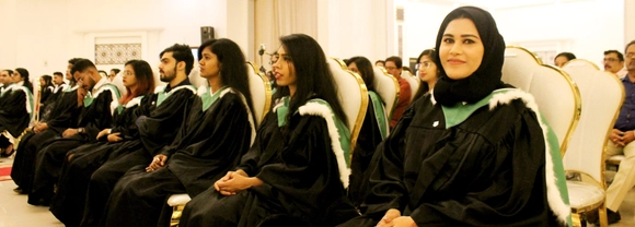 Graduates sitting during the graduation celebration event at Stirling's RAK campus
