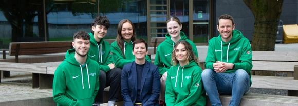 Volunteer Zambia Student Volunteers sit with Cathy Gallagher, Executive Director of Sport