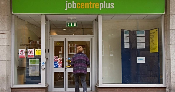 person walking into job centre