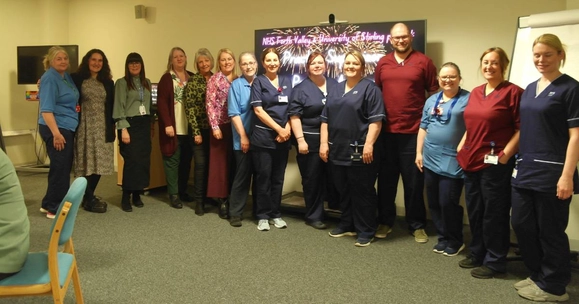 A group of the nurses being celebrated at the event pose for a photo