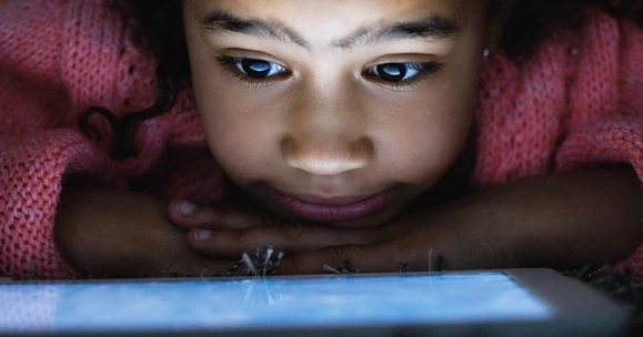 Kid on an ipad