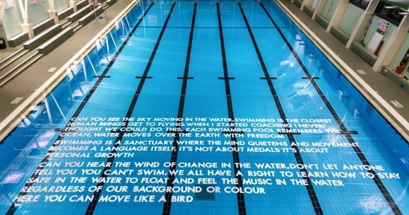 Poem from Robert Montgomery installed on University of Stirling pool.
