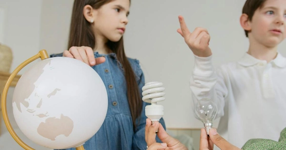 boy and girl with globe