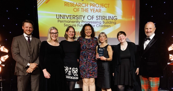 people on stage receiving award