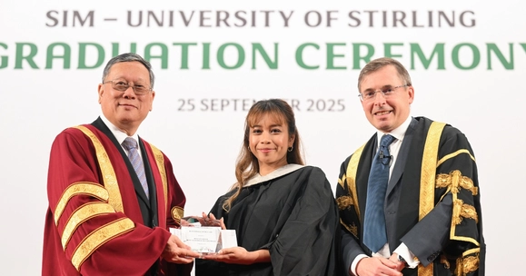 two men and one women at graduation