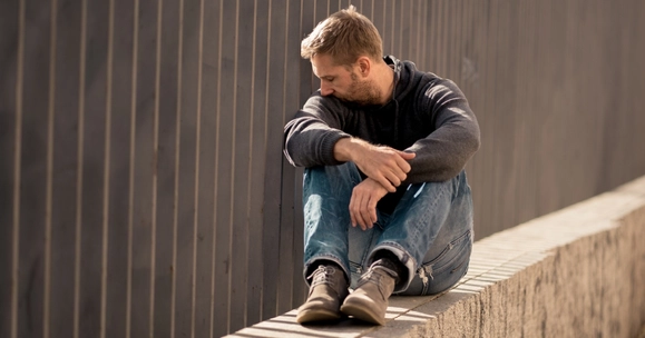 Man sitting on wall