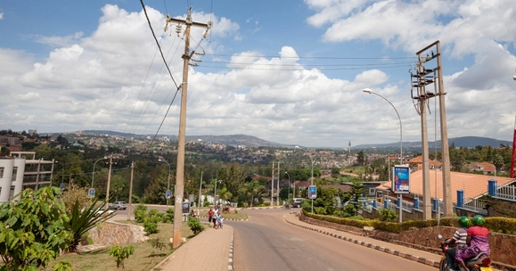electricity poles and people on motorbike in Rwanda