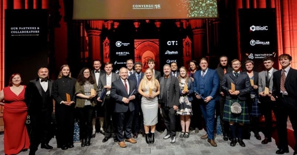 Group of people on a stage at awards