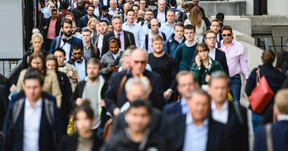 workers walking in crowd on street